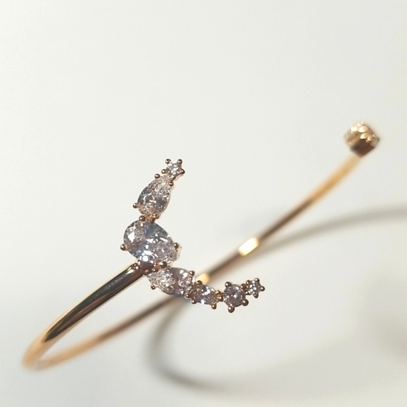 Swarovski Jewelry - Swarovski PENELOPE CRUZ MoonSun Open Bangle in Rose Gold